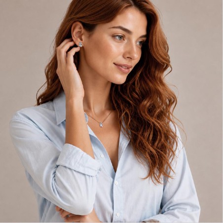 Orecchini lobo in oro bianco 750/°°° e acquamarina con goccia