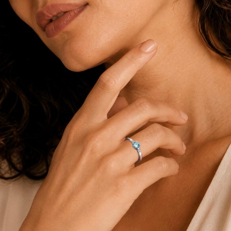 Anello in oro bianco 375/ooo con topazio azzurro e diamante naturale